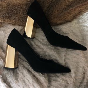 Black and chrome gold heels.